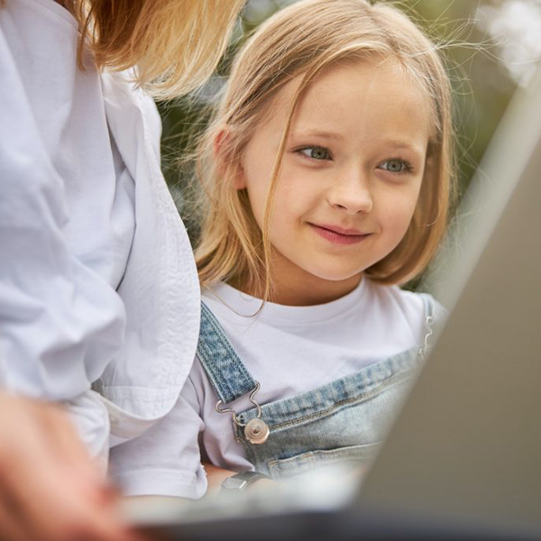girl looks at computer
